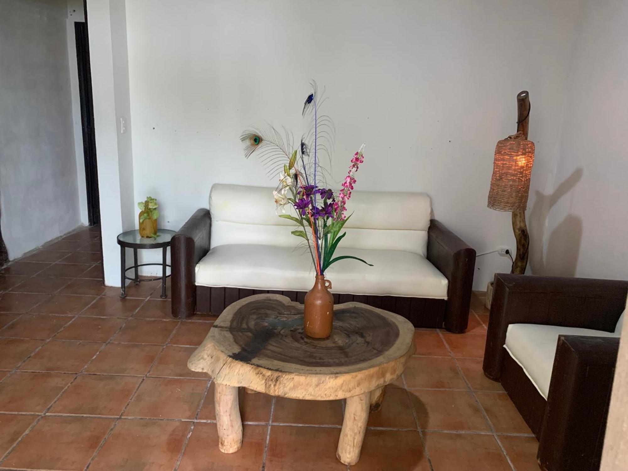 Casa Caribe Cancun Bagian luar foto A living room in a typical house in the community